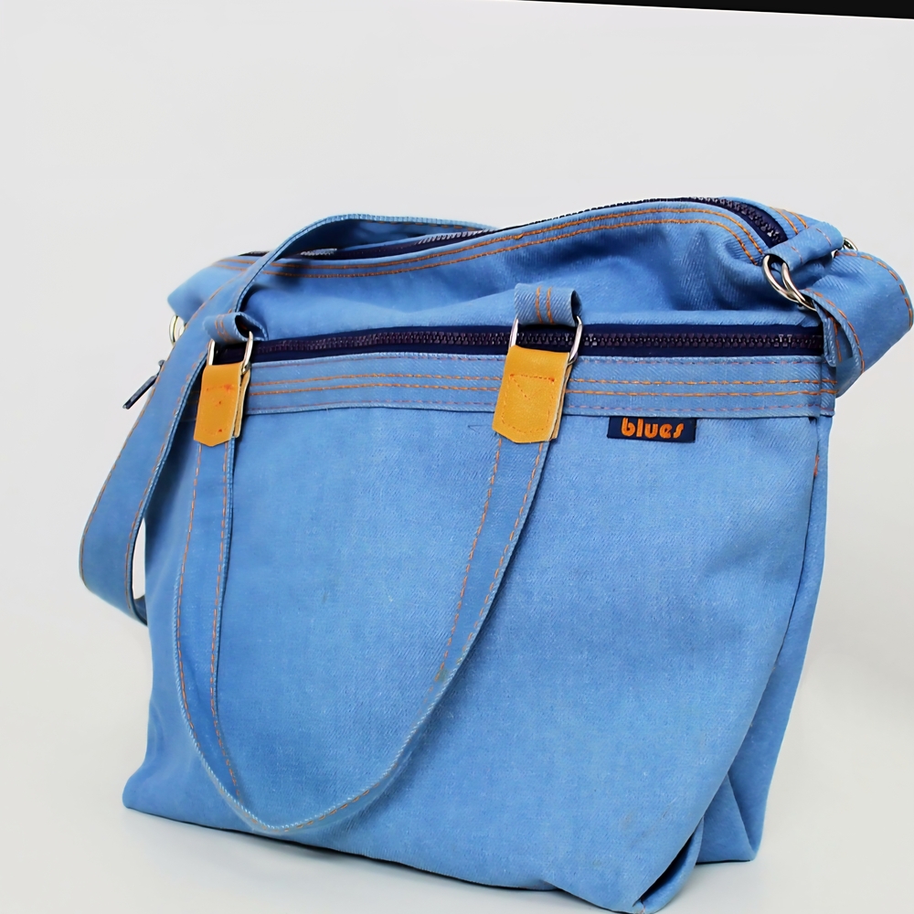 Blue Crossbody Bag with Adjustable Strap and Gold Hardware